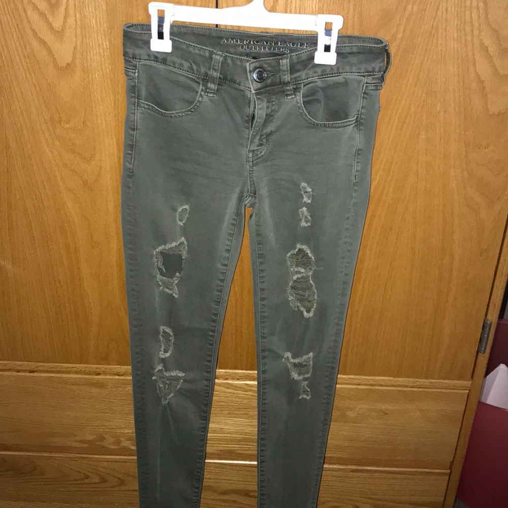 Distressed army green jeans